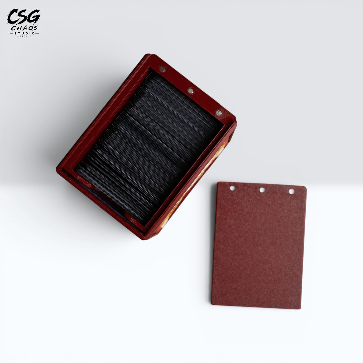 MTG Commander deck box with lid removed beside it, showing the internal divider and crimson frame — Chaos Studio Georgia