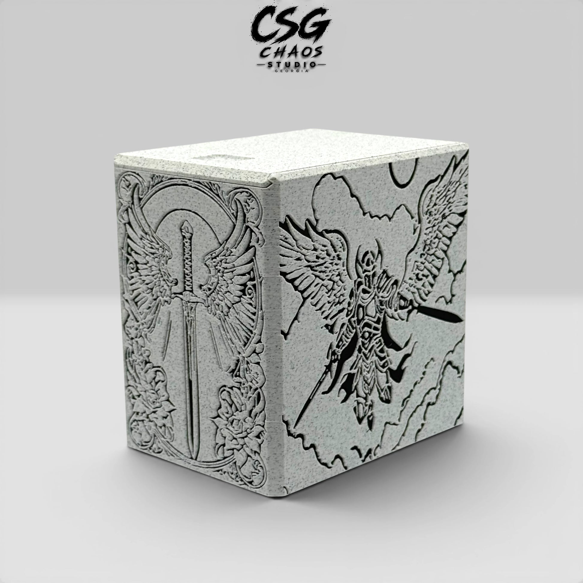 MTG commander deck box corner view showing winged sword front and armored angel side panel — Chaos Studio Georgia