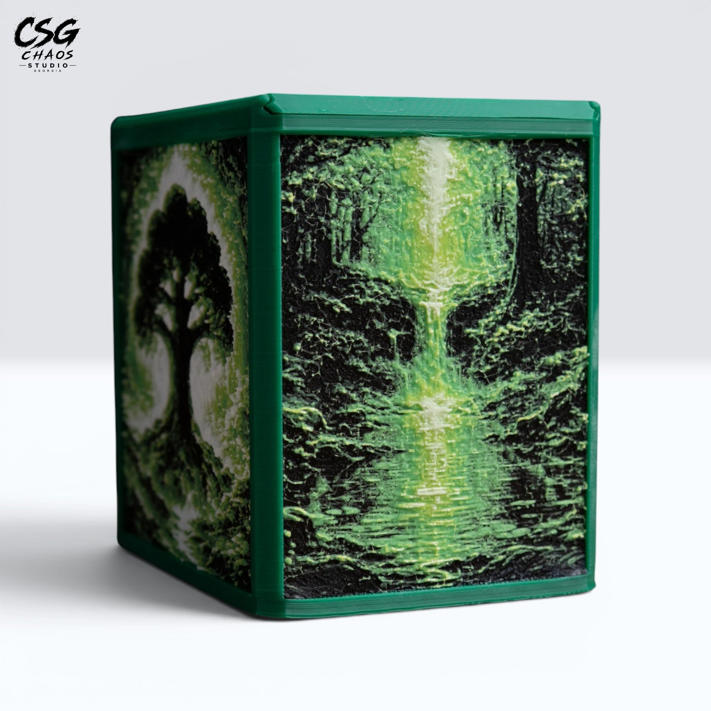 MTG Commander deck box in green with a Hueforge forest waterfall panel, front studio view — Chaos Studio Georgia
