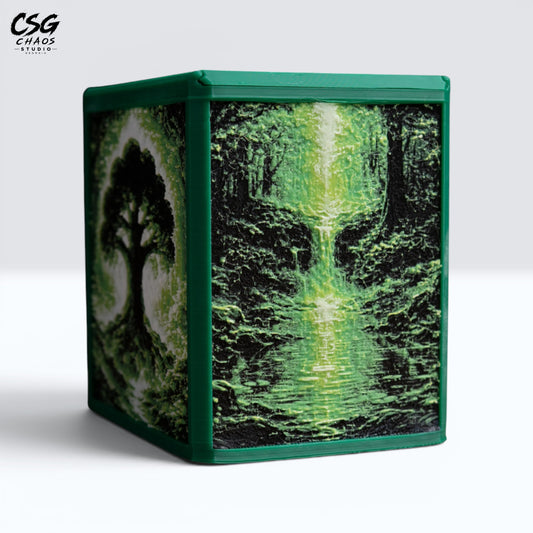 MTG Commander deck box in green with a Hueforge forest waterfall panel, front studio view — Chaos Studio Georgia