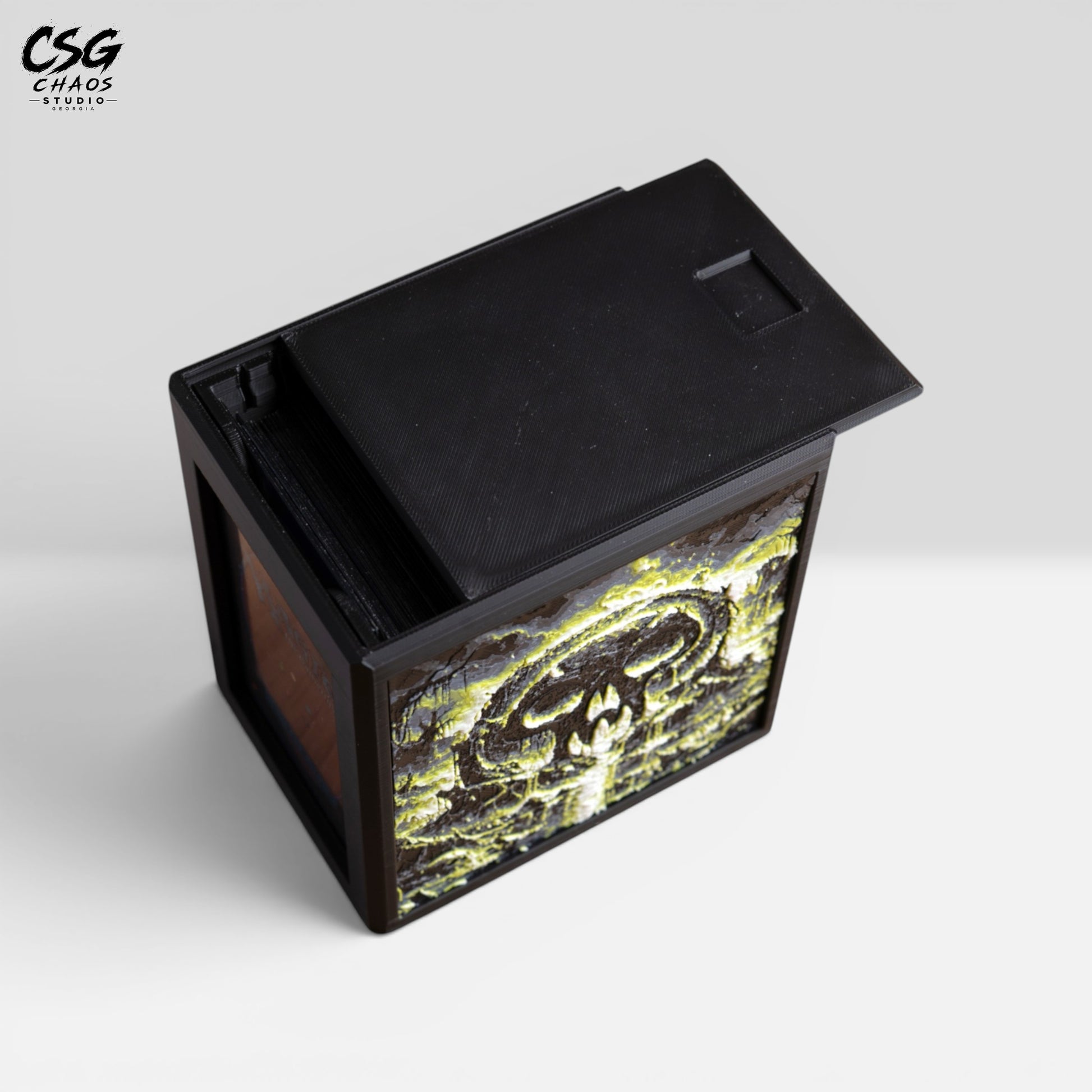 MTG Commander deck box with lid removed beside it, showing the internal divider and black frame — Chaos Studio Georgia