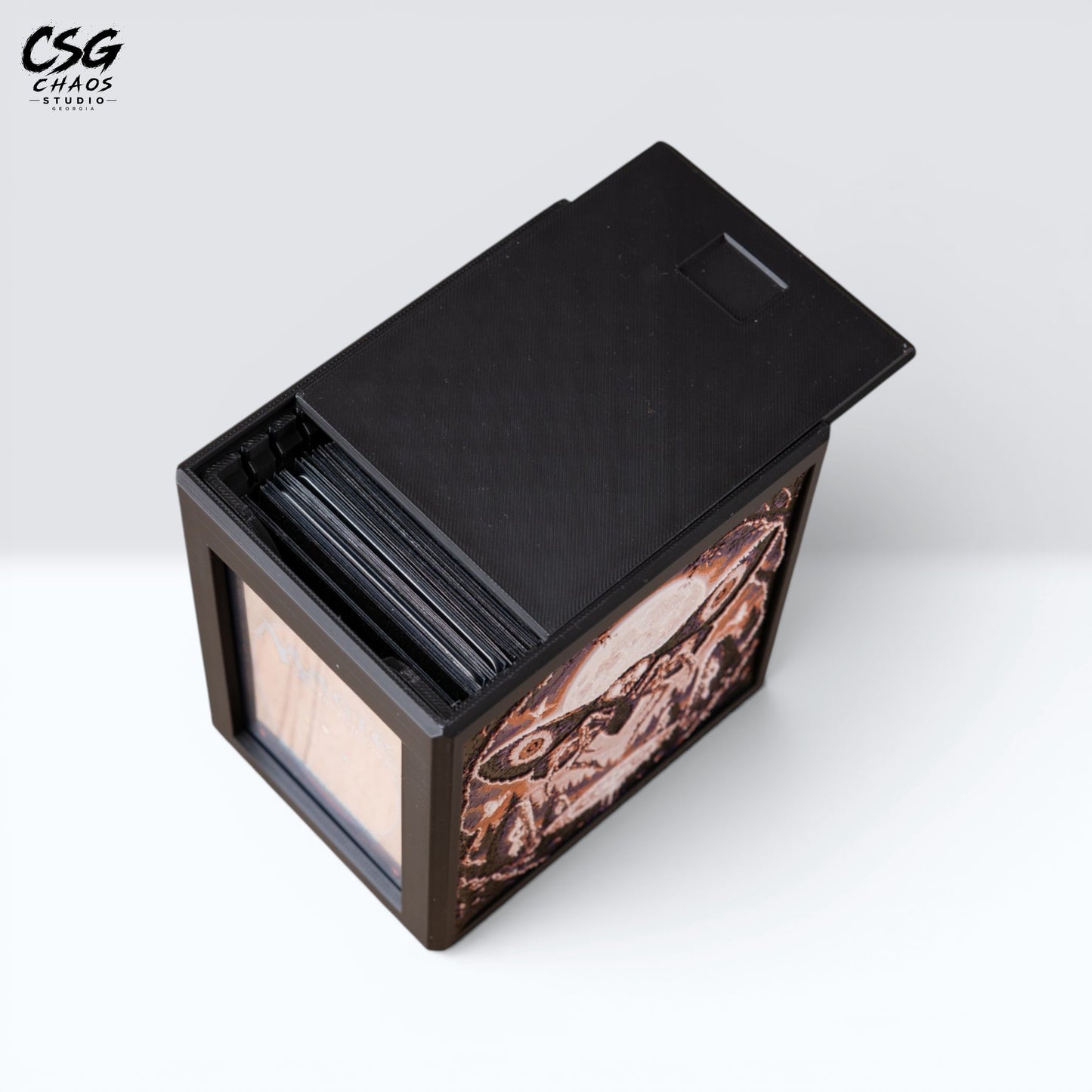 MTG Commander deck box with lid removed beside it, showing the internal divider and black frame — Chaos Studio Georgia