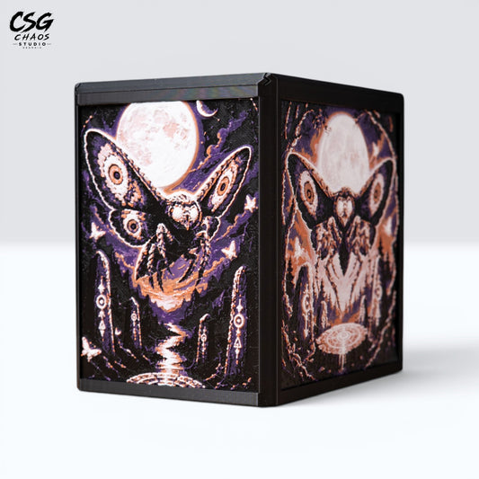MTG Commander deck box in black with a Hueforge moth and full moon panel in bronze, front view — Chaos Studio Georgia