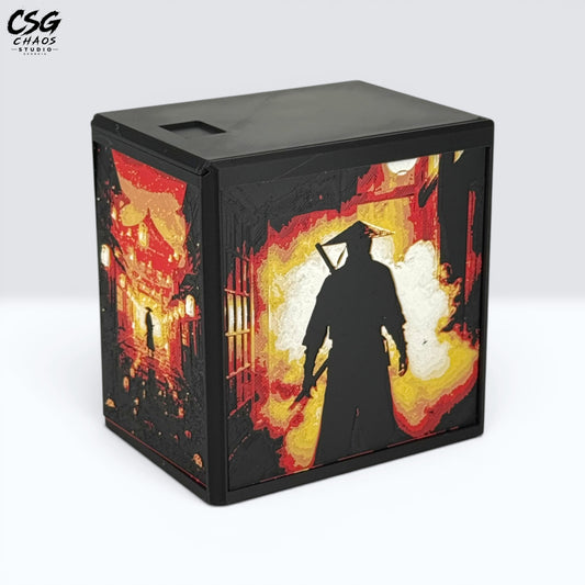 MTG Commander Deck Box PRISM series, front view of ninja alley scene with torii gate in red and gold Hueforge art — Chaos Studio Georgia