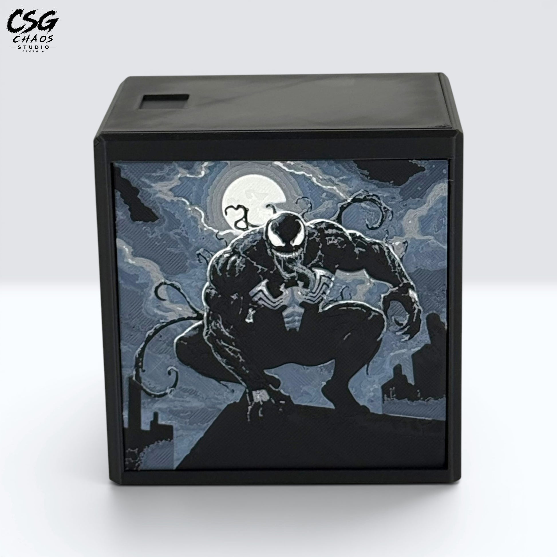MTG Commander Deck Box PRISM Series, front view of crouching dark symbiote antihero panel art on white background — Chaos Studio Georgia