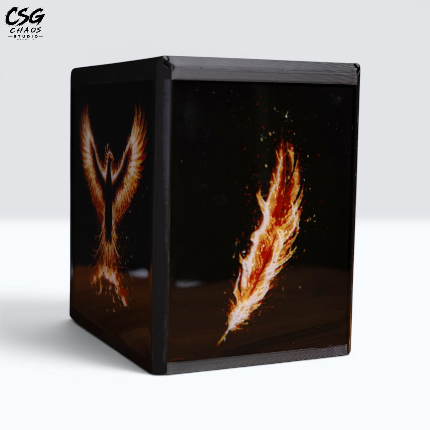 MTG Commander Deck Box PRISM Series, corner view with fiery phoenix wings art on black background — Chaos Studio Georgia