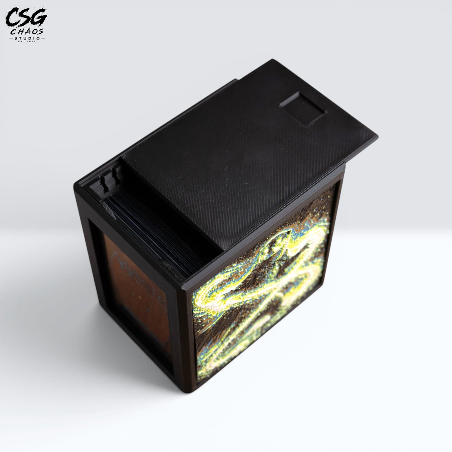 MTG Commander Deck Box PRISM Series, top-down view with lid open showing sleeved cards inside — Chaos Studio Georgia