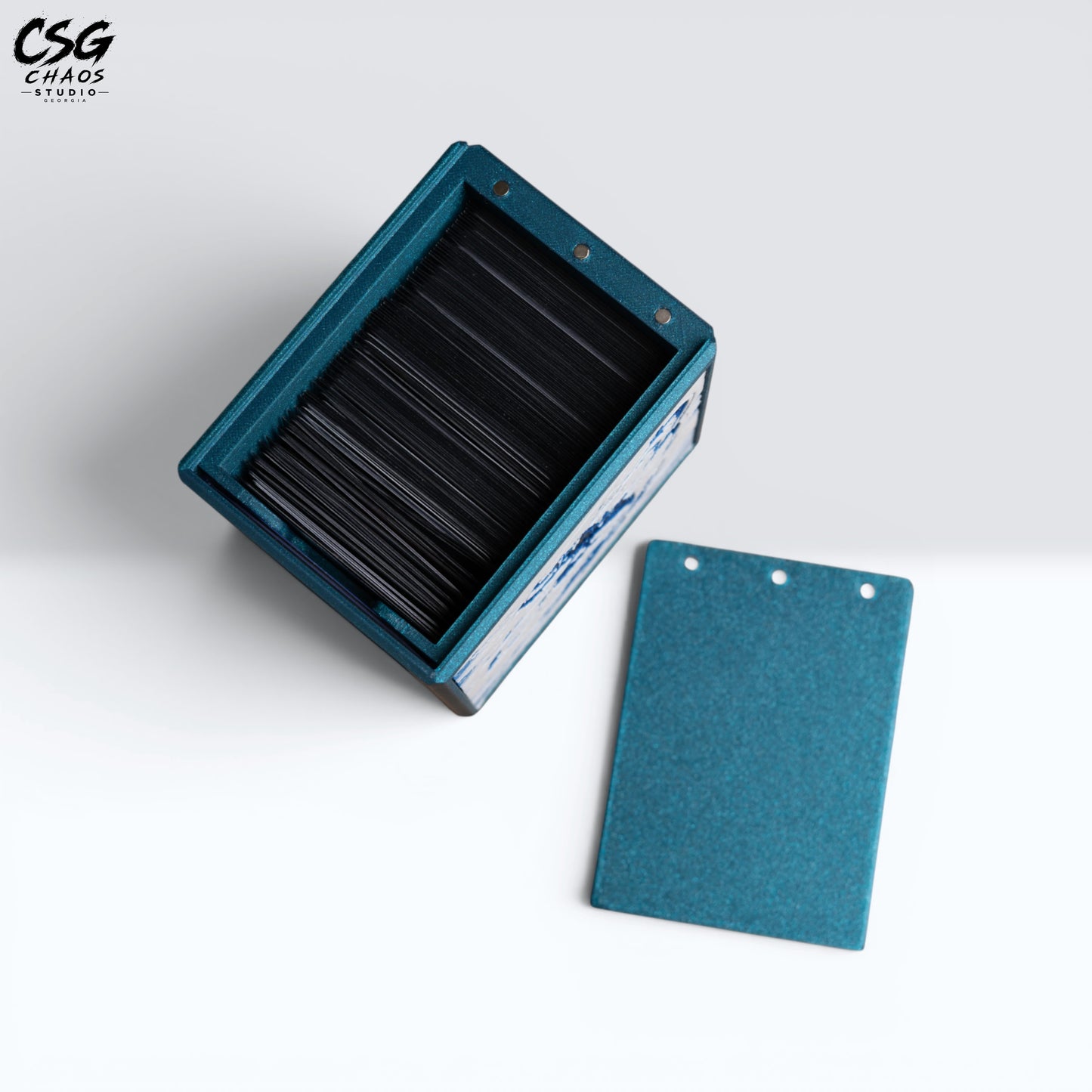 MTG Commander Deck Box PRISM Series, open lid with removable panel showing sleeved cards inside — Chaos Studio Georgia