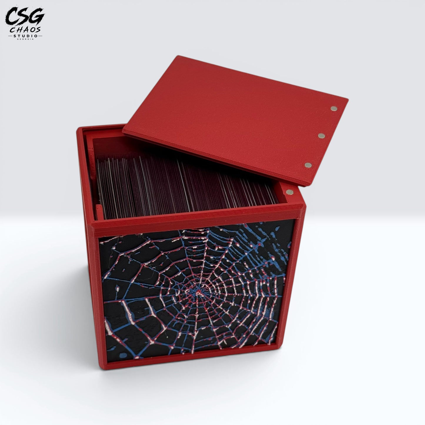 MTG Commander Deck Box PRISM Series, top-down view of open lid revealing dark red sleeved cards — Chaos Studio Georgia