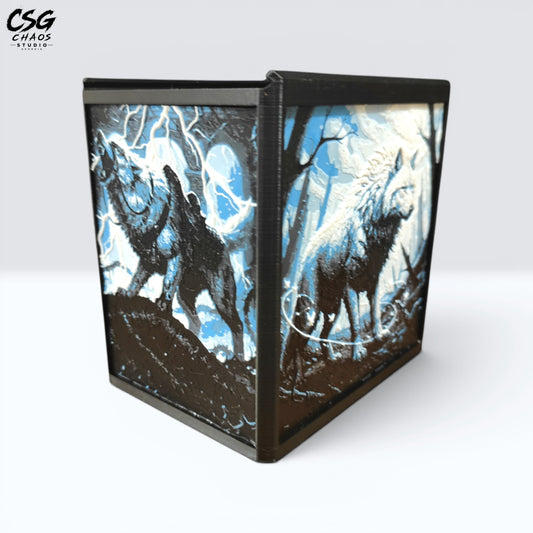 MTG Commander Deck Box PRISM Series, corner view with dark howling wolf and pale wolf art in blue forest — Chaos Studio Georgia