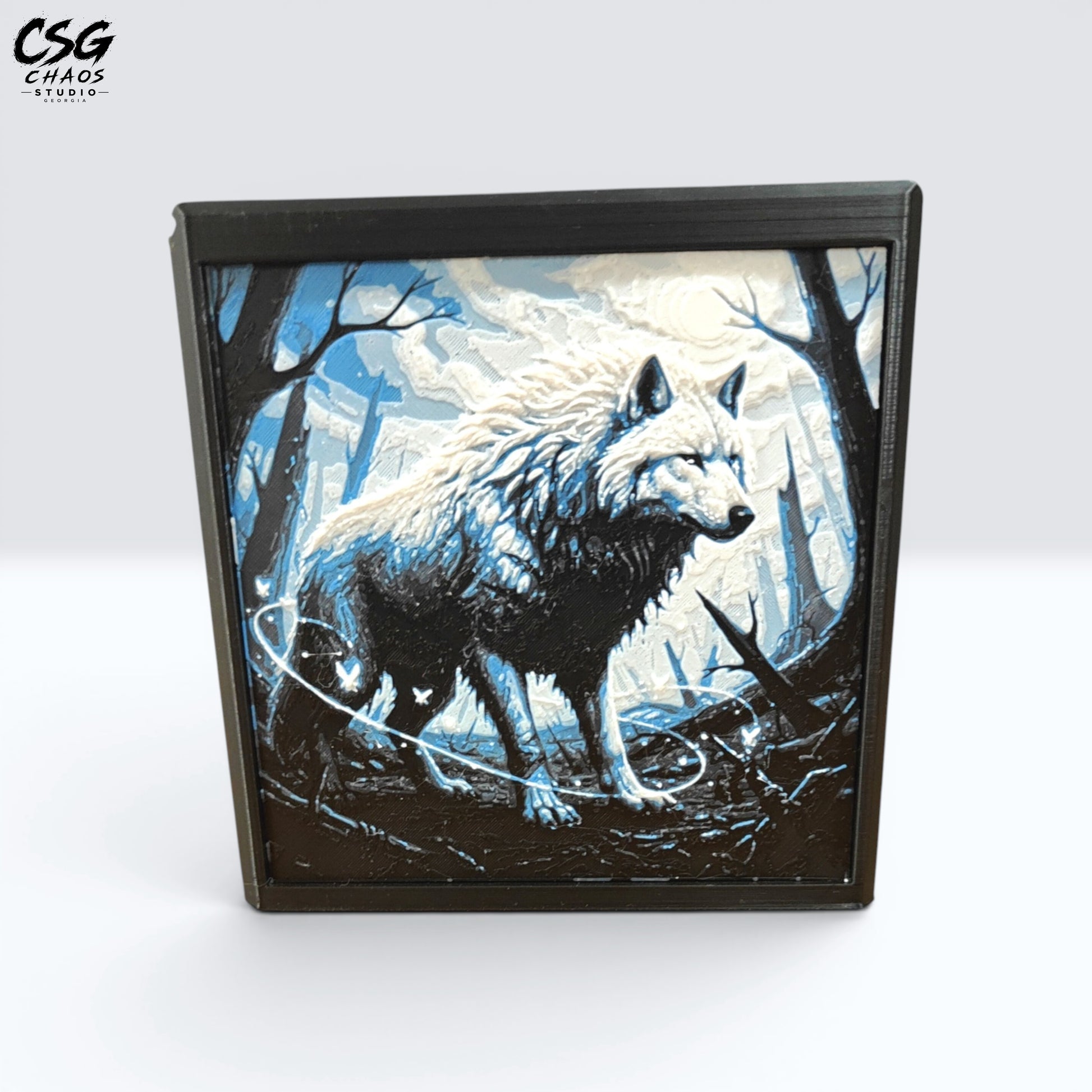 MTG Commander Deck Box PRISM Series, straight-on front view with pale wolf standing in moonlit snowy forest — Chaos Studio Georgia